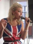 woman singing in union jack dress